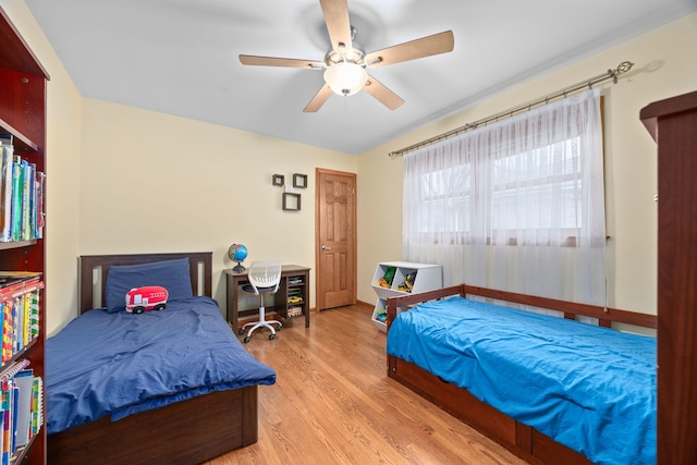 bedroom with ceiling fan and wood finished floors