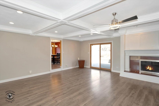 unfurnished living room with a glass covered fireplace, crown molding, beamed ceiling, and wood finished floors