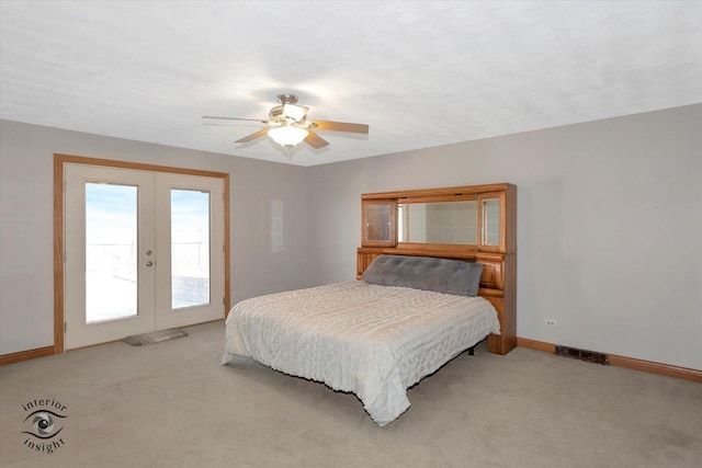 bedroom featuring baseboards, visible vents, access to exterior, french doors, and light colored carpet