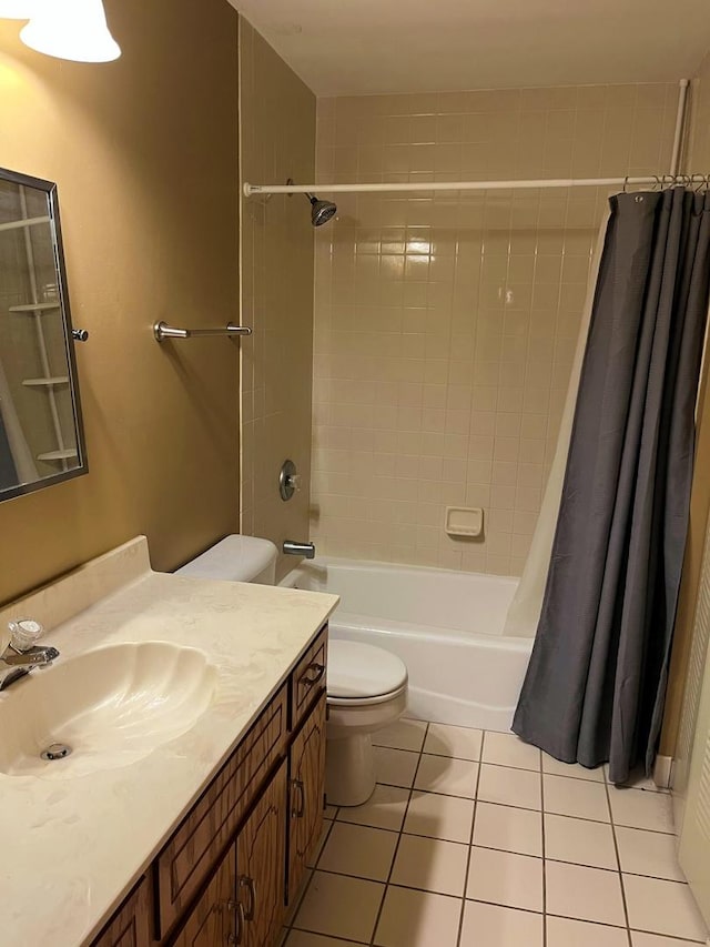 bathroom with toilet, shower / tub combo, tile patterned flooring, and vanity