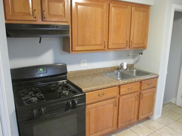 kitchen with black range with gas cooktop, range hood, light countertops, a sink, and light tile patterned flooring