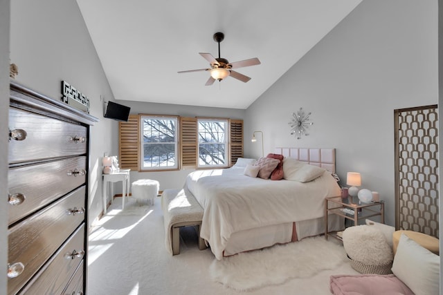 carpeted bedroom featuring high vaulted ceiling and ceiling fan