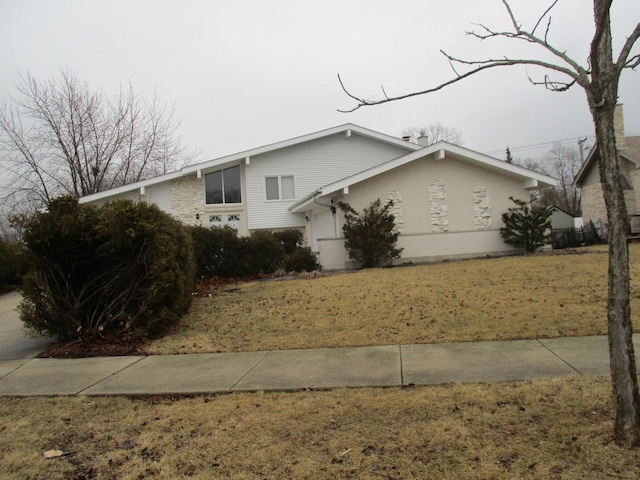 view of property exterior with a lawn