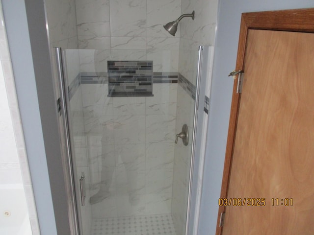 full bathroom with a stall shower