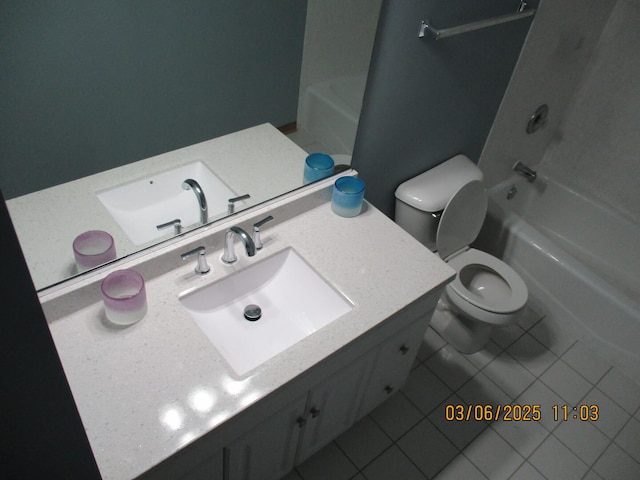 bathroom featuring toilet, tile patterned flooring, tub / shower combination, and vanity