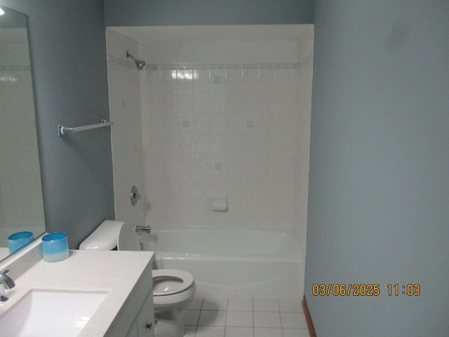 bathroom featuring toilet, tile patterned floors, shower / bath combination, and vanity