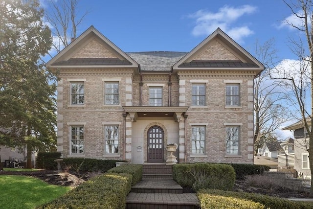 view of front of home with brick siding