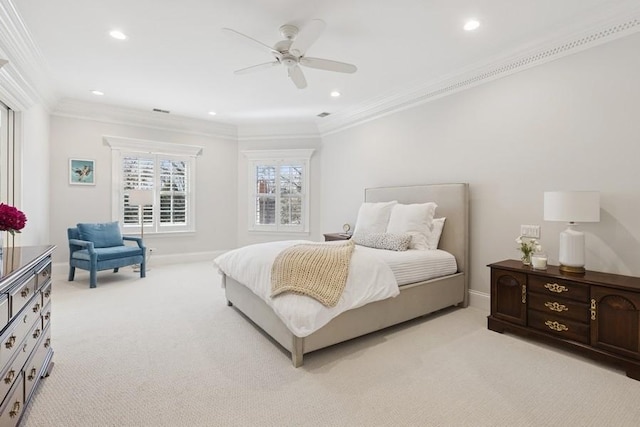 bedroom featuring crown molding, light colored carpet, and baseboards