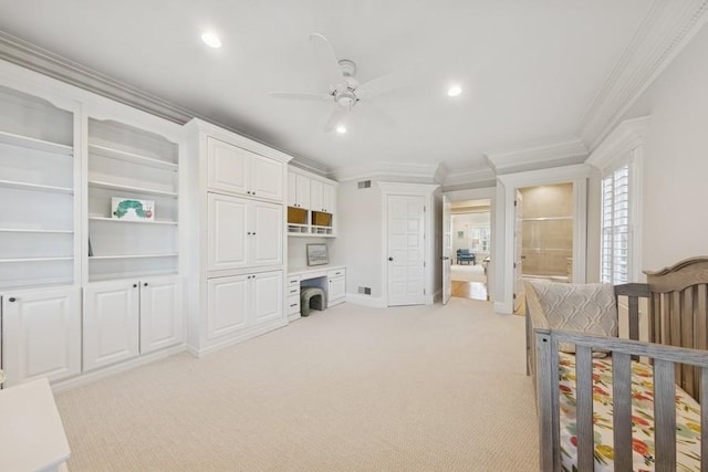 bedroom featuring visible vents, crown molding, light colored carpet, built in desk, and recessed lighting