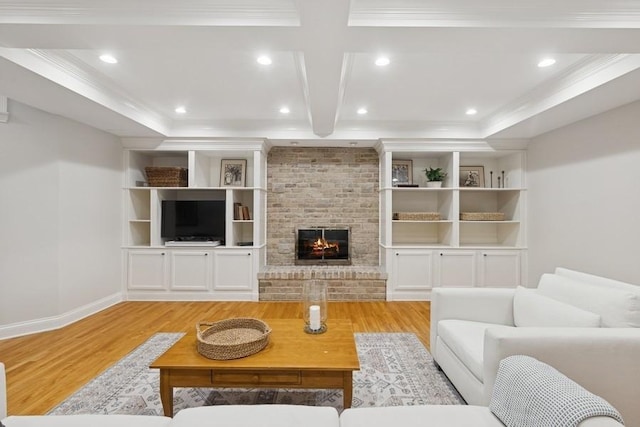 living area with a fireplace, recessed lighting, light wood-style floors, and ornamental molding