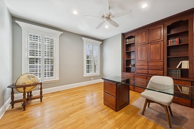 office area featuring recessed lighting, baseboards, light wood-style floors, and a ceiling fan