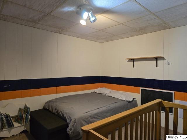 bedroom featuring a paneled ceiling