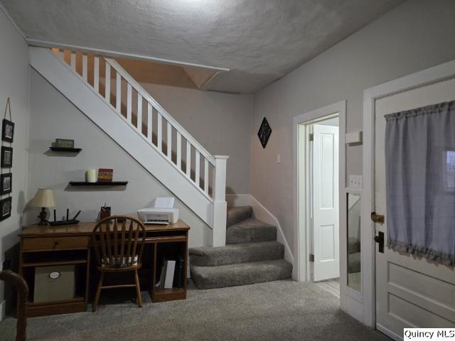 interior space with carpet floors and stairs