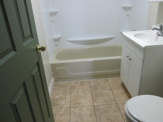 full bathroom featuring tile patterned flooring, shower / bathing tub combination, and vanity