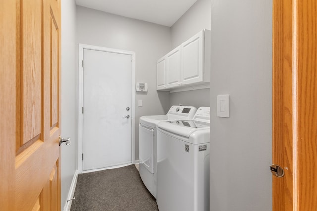 washroom featuring cabinet space and separate washer and dryer