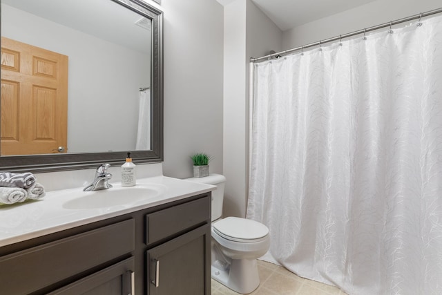 bathroom with a shower with shower curtain, tile patterned flooring, vanity, and toilet