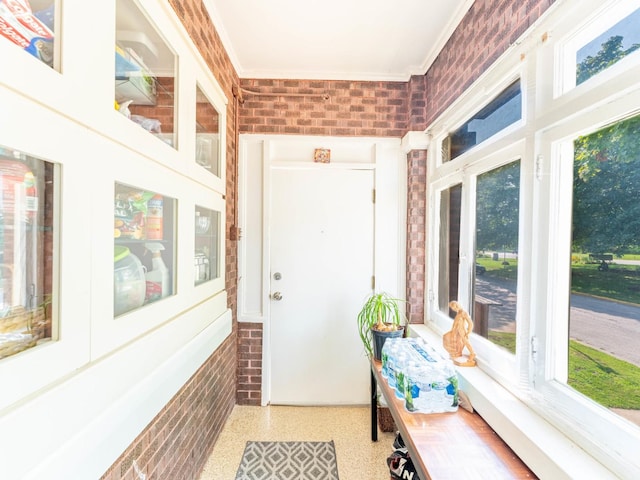 sunroom / solarium featuring plenty of natural light