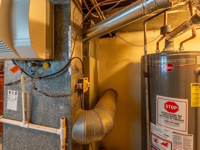 utility room featuring gas water heater