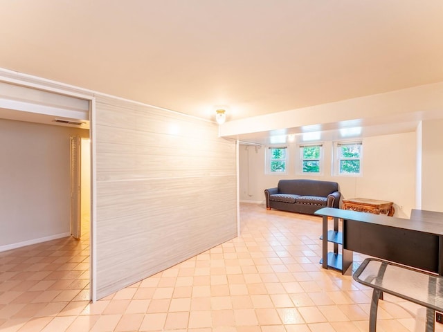 living room with baseboards and visible vents