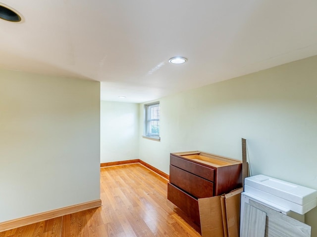 empty room with light wood-style floors and baseboards