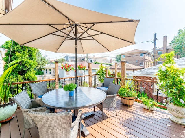 wooden terrace with outdoor dining area