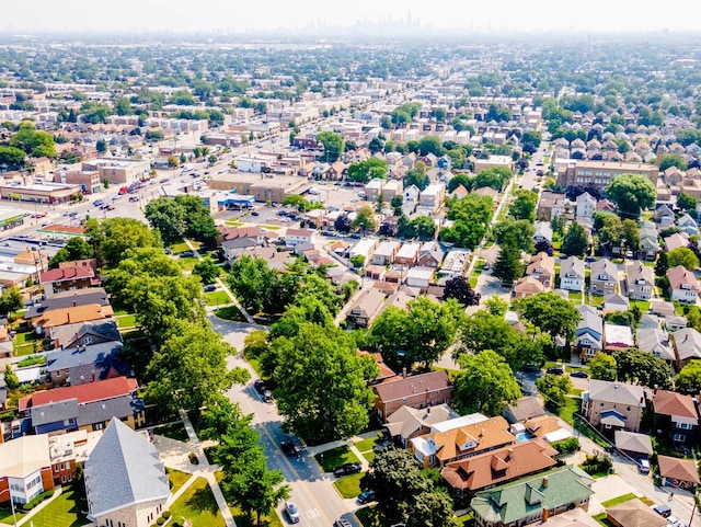 birds eye view of property with a residential view