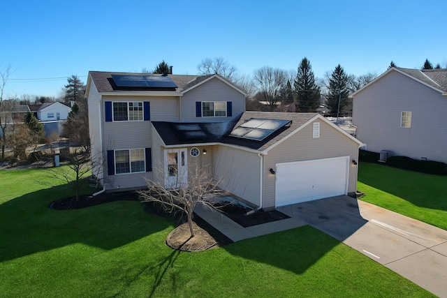 950 Donnelly Pl, Mchenry, IL 60050 - traditional-style house featuring solar panels, a garage, driveway, and a front yard