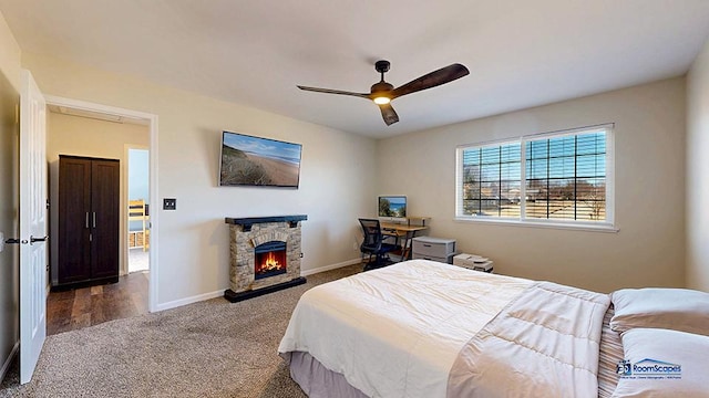 950 Donnelly Pl, Mchenry, IL 60050 - bedroom featuring carpet floors, a stone fireplace, and a ceiling fan