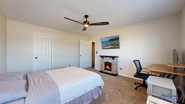 950 Donnelly Pl, Mchenry, IL 60050 - carpeted bedroom with a stone fireplace, a ceiling fan, and a desk