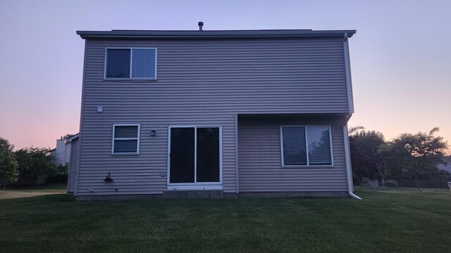 950 Donnelly Pl, Mchenry, IL 60050 - back of house featuring a lawn