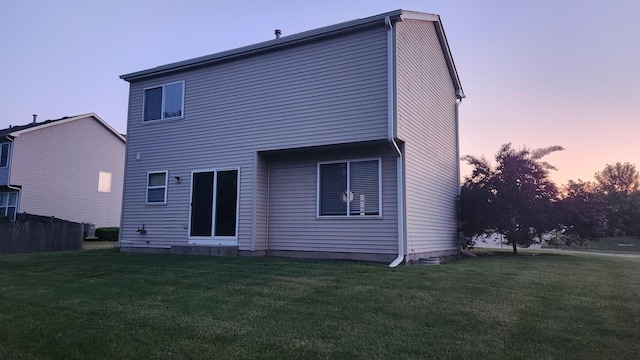 950 Donnelly Pl, Mchenry, IL 60050 - back of property at dusk with a lawn