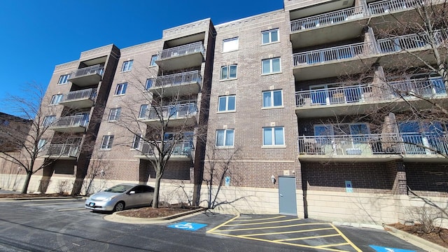 view of property featuring uncovered parking