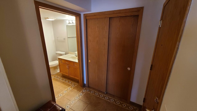 hall with light tile patterned flooring