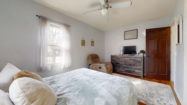 bedroom featuring ceiling fan and wood finished floors