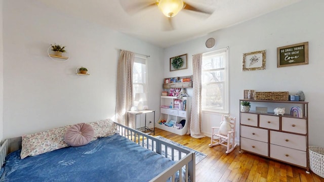 bedroom featuring ceiling fan and hardwood / wood-style floors