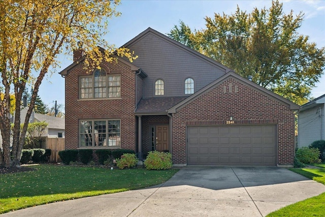 traditional-style home featuring concrete driveway, an attached garage, a front yard, brick siding, and fence