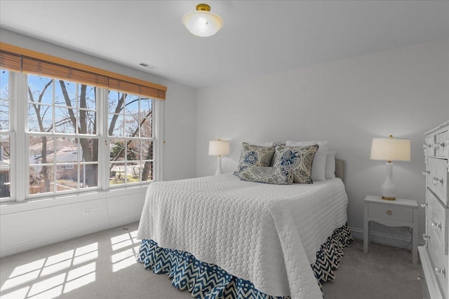 bedroom with carpet floors and visible vents