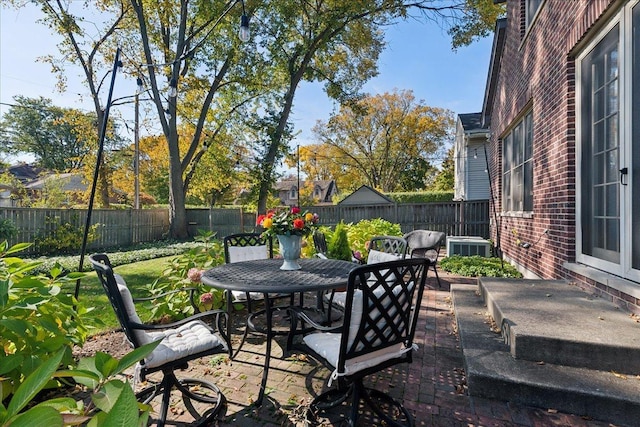 view of patio featuring outdoor dining area and a fenced backyard