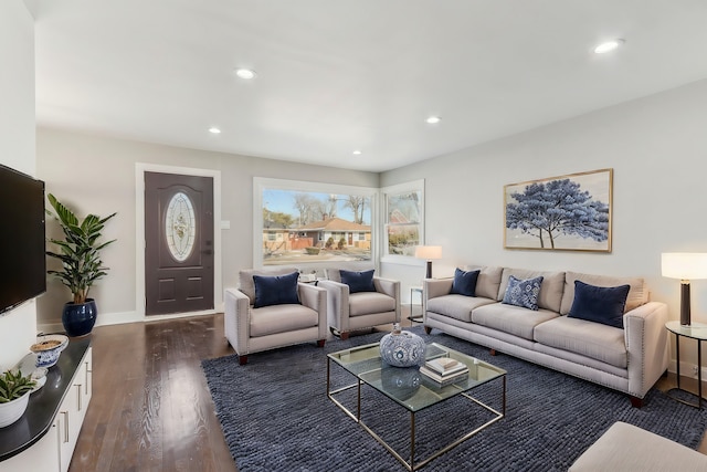 living area with recessed lighting, dark wood-style flooring, and baseboards