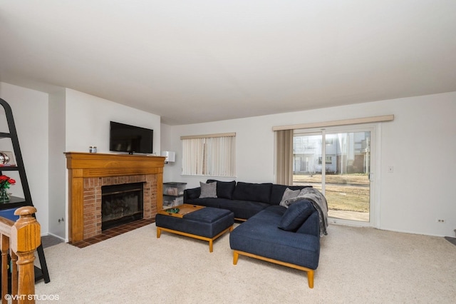 carpeted living room with a fireplace