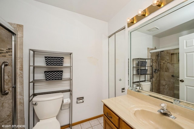 full bath featuring vanity, a shower stall, toilet, and tile patterned floors