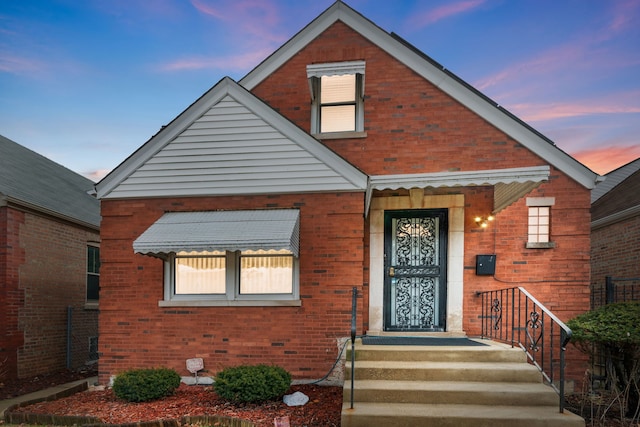 view of front of home with brick siding