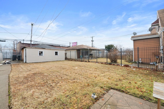 view of yard featuring an outbuilding and fence