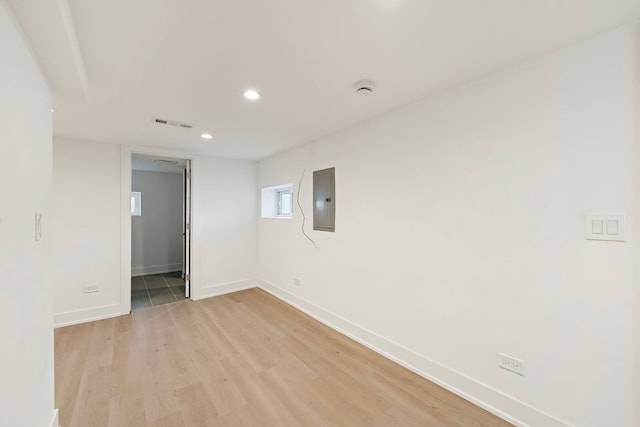 spare room with recessed lighting, visible vents, light wood-style flooring, electric panel, and baseboards