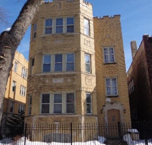 view of building exterior featuring a fenced front yard