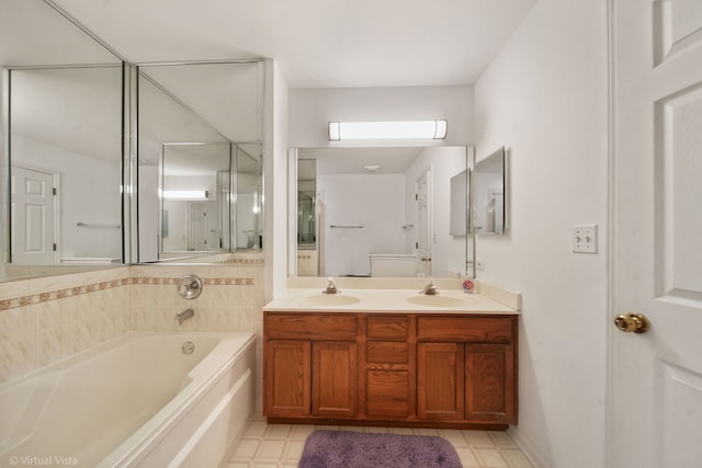 full bath featuring double vanity, a sink, a bath, and tile patterned floors