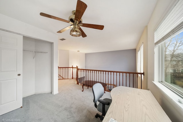 carpeted office featuring visible vents