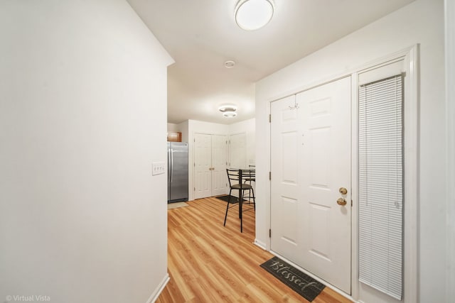 entrance foyer featuring light wood-style flooring