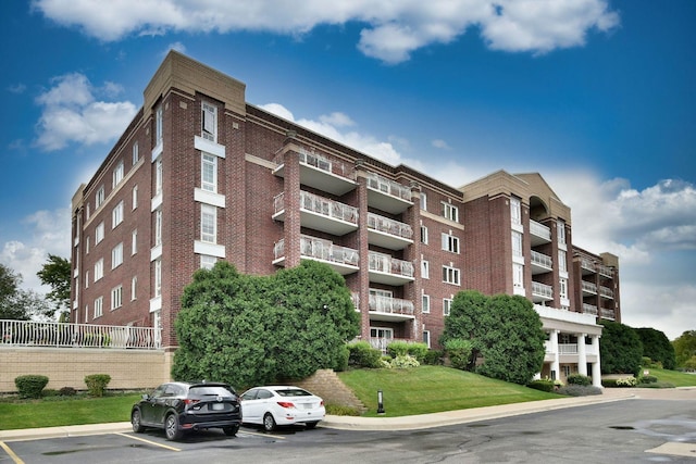 view of property featuring uncovered parking