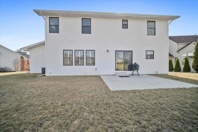 back of house with a patio and a yard